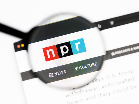 Milan, Italy 2026, 20 Apr Closeup of npr website on a laptop screen. npr logo under a magnifying glass.