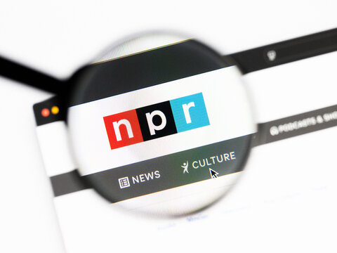 Milan, Italy 2026, 20 Apr Closeup of npr website on a laptop screen. npr logo under a magnifying glass.