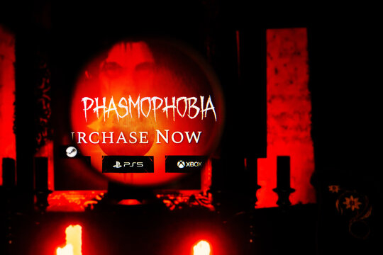 Milan, Italy 2026, 20 Apr Closeup of Phasmophobia website on a laptop screen. Phasmophobia logo under a magnifying glass.