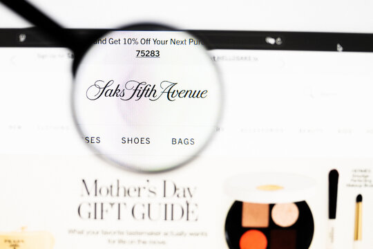 Milan, Italy 2026, 20 Apr Closeup of Saks Fifth Avenue website on a laptop screen. Saks Fifth Avenue logo under a magnifying glass.