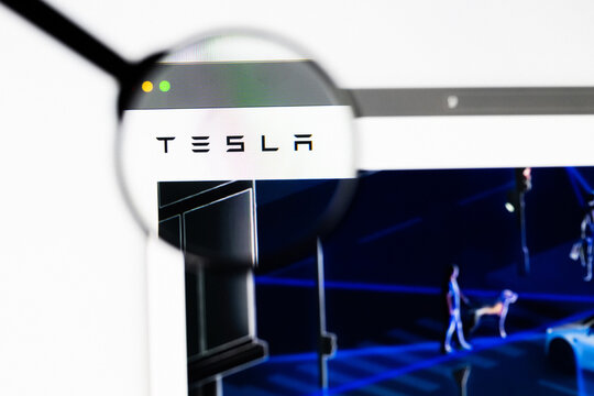 Milan, Italy 2026, 20 Apr Closeup of Tesla website on a laptop screen. Tesla logo under a magnifying glass.