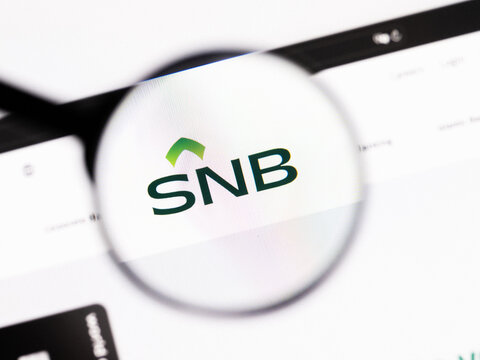 Milan, Italy 2026, 20 Apr Closeup of The Saudi National Bank SNB website on a laptop screen. The Saudi National Bank SNB logo under a magnifying glass.