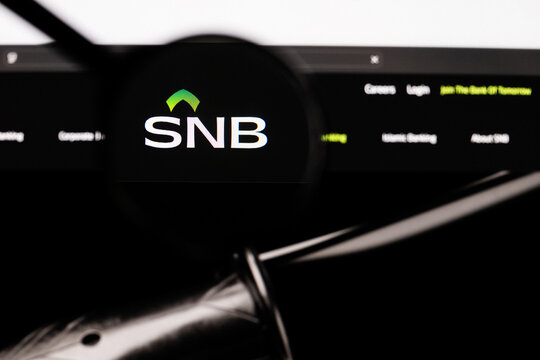 Milan, Italy 2026, 20 Apr Closeup of The Saudi National Bank SNB website on a laptop screen. The Saudi National Bank SNB logo under a magnifying glass.