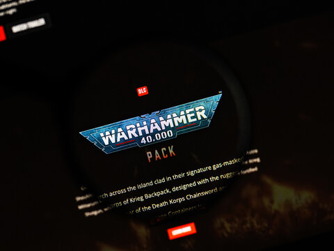 Milan, Italy 2026, 20 Apr Closeup of Warhammer 40000 website on a laptop screen. Warhammer 40000 logo under a magnifying glass.
