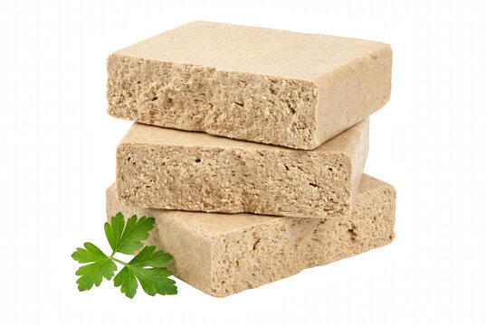 Stacked Rectangular Pieces of Traditional Sunflower Seed Halva with a Fresh Parsley Garnish