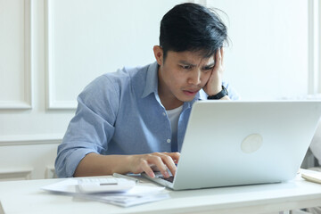 Fototapeta premium close up young business owner man hand on forehead after checking about order and market about plant in the room for startup and business lifestyle concept