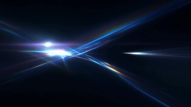 Slow motion tracking shot of abstract light beams converging and crossing over dark void with lens flare prism spectrum and particles in studio background