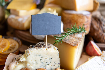 Assorted cheeses with blank label.