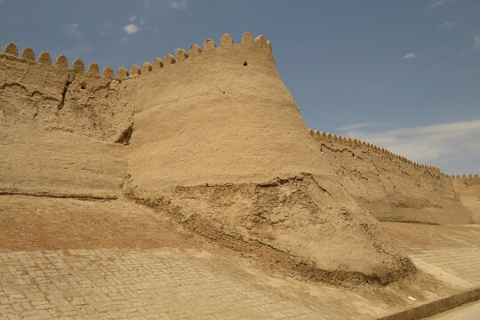 Historic defensive wall of Itchan Kala in the city of Khiva. Uzbekistan. Built with mud bricks and coated with a mixture of mud and straw. World Heritage Site.