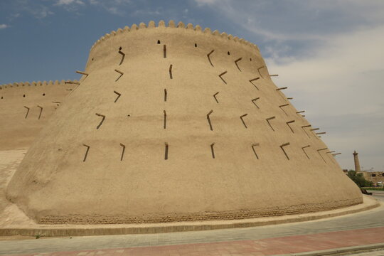 Historic defensive wall of Itchan Kala in the city of Khiva. Uzbekistan. Built with mud bricks and coated with a mixture of mud and straw. World Heritage Site.