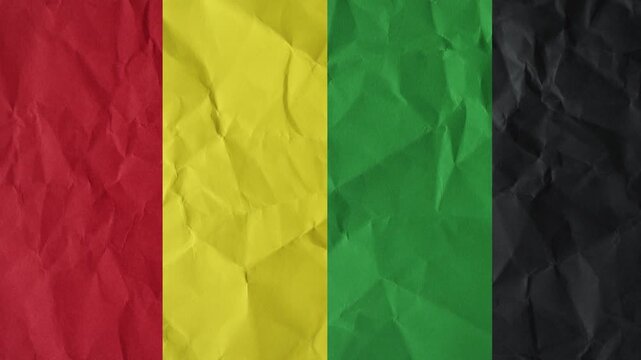Red Yellow Green Black Flag on Crushed Paper Background