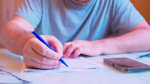 Cinematic  close up shot of concentrated writing on a document.Soft window light. Visualizes critical tax filing, serious decision making, family budget and meticulous audit.