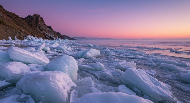 Beautiful winter landscape with ice hummocks on frozen lake during colorful sunrise. Natural scenery of frozen lake ice.