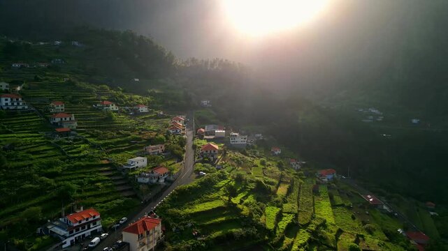 Cinematic Aerial View of Hillside Village and Green Ariculture Terraces in Sun ays