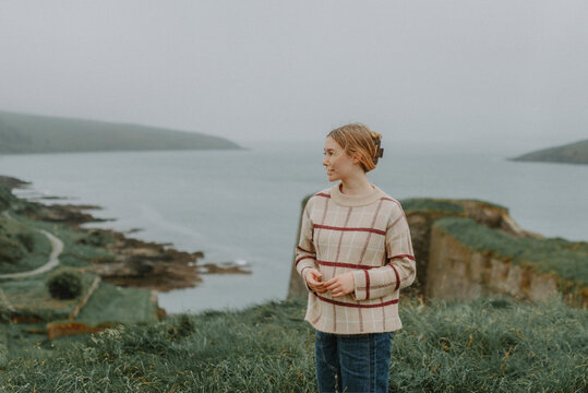 Female Traveler Enjoying Coastal View in County Cork, Ireland