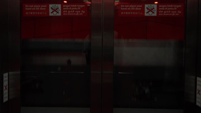 Person traveling inside a moving elevator lift cabin