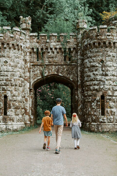 Family Walking Through Historic Ballysaggartmore Castle in County Waterford, Ireland