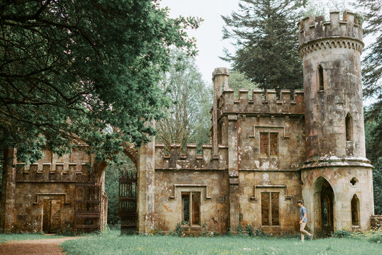 Man Walking Through Historic Ballysaggartmore Towers in County Waterford, Ireland