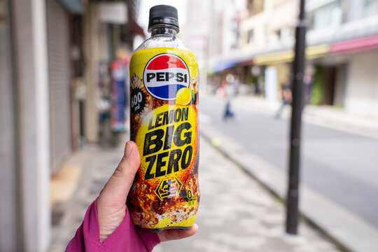 Tokyo, Japan - April 14, 2026: Hand holds a bottle of Pepsi Lemon Big Zero soda pop