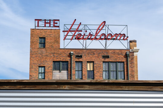 The Heirloom Hotel sign and building in Laurel, Mississippi