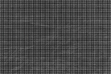 Fototapeta premium A dark background with leaves and branches is shown up close.