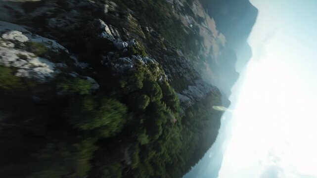 FPV Drone Shot Swooping Dow White Rocky Peak to GreenValley