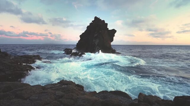 Aerial Shot of Volcanic Rock Cliff in Ocean during Patel Sunset