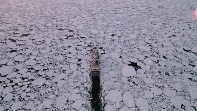 Aerial Shot of Expedition Vessel in Vast Fragmented Plar Ice Field