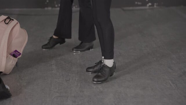 Group of young female tap dancers in a modern dance studio