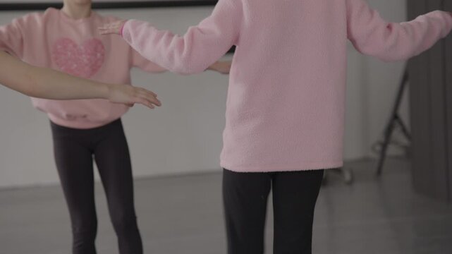 Group of young female tap dancers in a modern dance studio