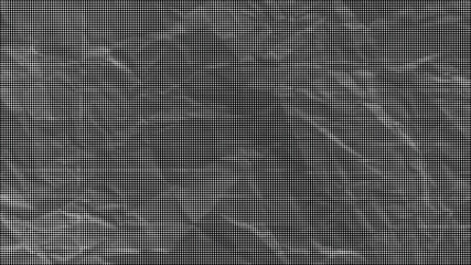 Fototapeta premium A close-up view of a crumpled gray surface with many wrinkles and creases.