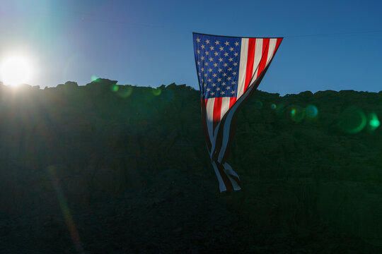 Close-Up of Giant American Flag Hanging Against Blue Sky and Desert Cliffs to Celebrate Patriotism and the 4th of July for the United States 250 Celebration 05