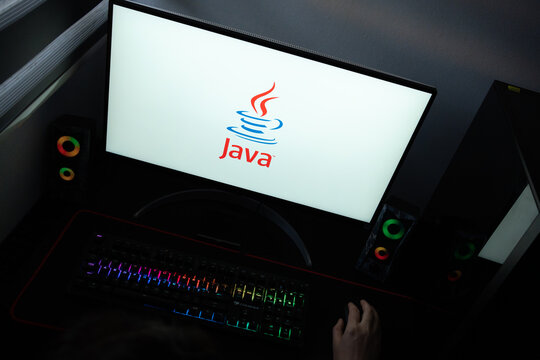 Punta Arenas, Chile &ndash; June 12, 2026: A desktop PC monitor showing the Oracle Java software branding on a white background, surrounded by an illuminated gaming keyboard and peripherals
