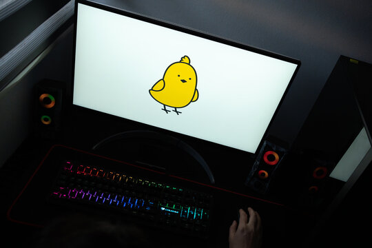 Punta Arenas, Chile &ndash; June 12, 2026: A desktop PC monitor showing the Koo Chat messaging platform branding on a white background, surrounded by an illuminated gaming keyboard and peripherals