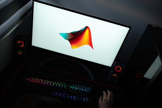 Punta Arenas, Chile &ndash; June 12, 2026: A desktop PC monitor showing the MathWorks MATLAB programming platform branding on a white background, surrounded by an illuminated gaming keyboard and peripherals