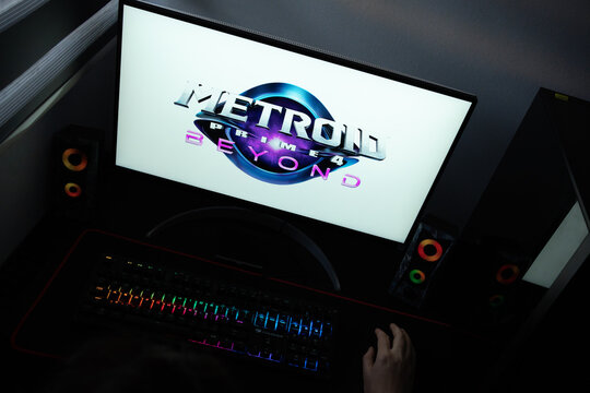 Punta Arenas, Chile &ndash; June 12, 2026: A desktop PC monitor showing Nintendo's Metroid Prime 4 Beyond title branding on a white background, surrounded by an illuminated gaming keyboard and peripherals