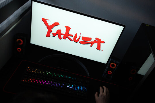 Punta Arenas, Chile &ndash; June 17, 2026: A desktop PC monitor showing the Sega Yakuza (Like a Dragon) gaming franchise branding on a white background, surrounded by an illuminated gaming keyboard 