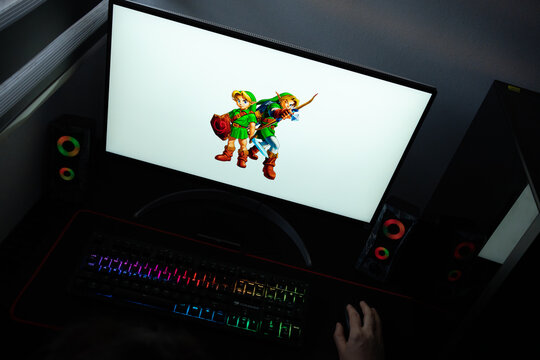 Punta Arenas, Chile &ndash; June 17, 2026: Official artwork of Young Link and Adult Link from The Legend of Zelda: Ocarina of Time displayed on a computer screen in a dark room workspace setup