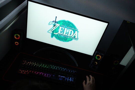 Punta Arenas, Chile &ndash; June 17, 2026: The official teal ring and damaged Master Sword logo of The Legend of Zelda: Tears of the Kingdom displayed on a computer screen in a dark room workspace setup