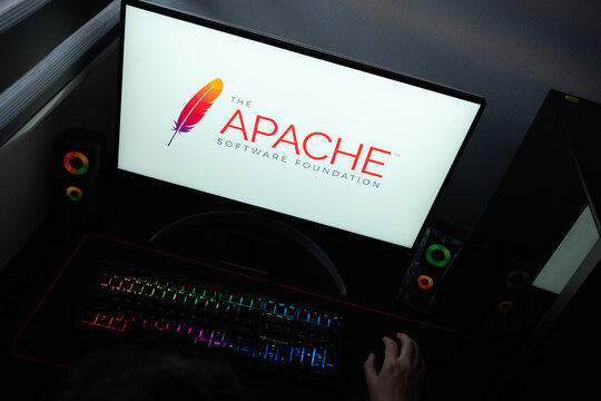 Punta Arenas, Chile &ndash; June 12, 2026: The official The Apache Software Foundation logo featuring a colored feather displayed on a computer screen in a dark workspace setup with an RGB backlit keyboard