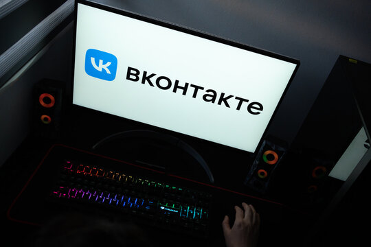 Punta Arenas, Chile &ndash; June 12, 2026: The official VK (VKontakte) social media network logo and cyrillic text displayed on a computer screen in a dark room workspace setup with an RGB backlit keyboard