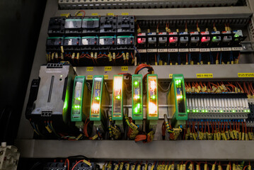 Programmable logic controller system with communication modules operating in normal status inside electric cabinet © Iv