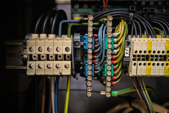 Industrial control panel wiring with terminal blocks and copper busbars