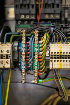 Industrial control panel wiring with terminal blocks and copper busbars