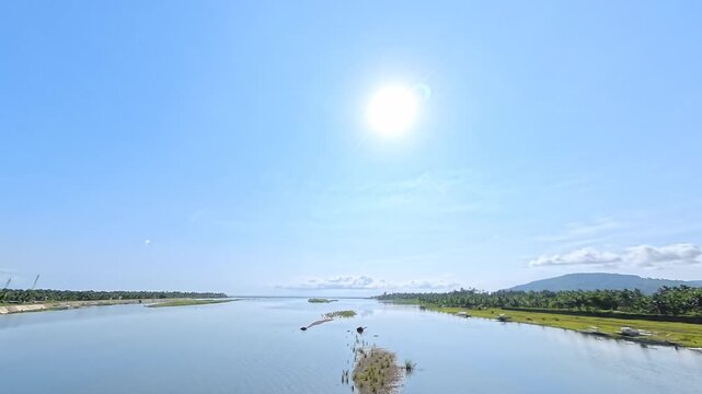 Cinematic Sunrise over River and Ocean with Mountain View and Engine Ambience