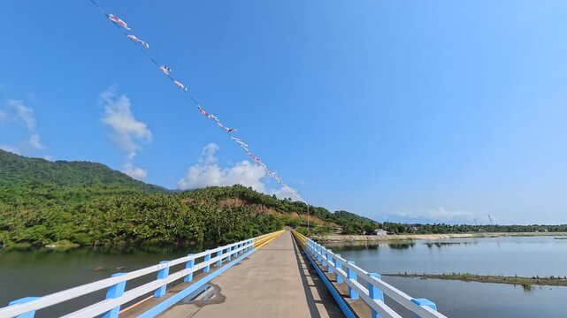 Crossing a River Bridge with a Scenic View of Mountains and Clouds under a Blue Sky, featuring Engine Ambience