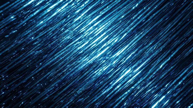 Abstract blue background with diagonal light streaks creating a textured, dynamic pattern.