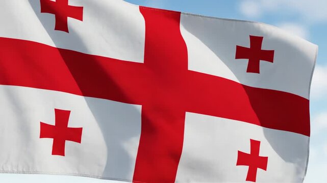 Georgian flag waving in close-up with red crosses on white fabric against blurred blue sky, national identity concept, Georgia Day, Georgia Independence Day