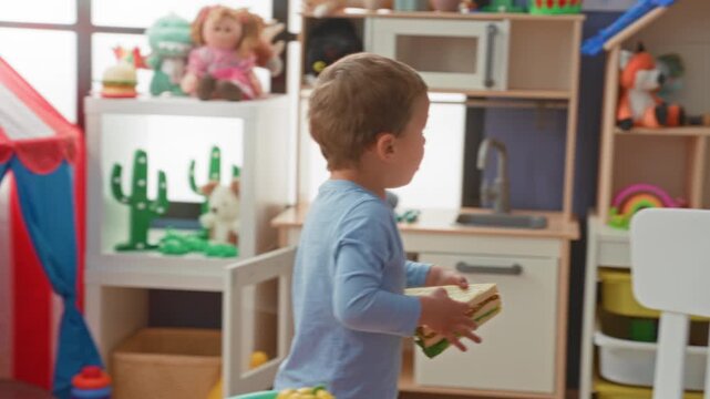 Boy holds toy sandwich and reaches for stuffed monkey inside a playroom building; playfulness exploration.