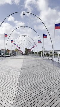 Security and people leaving the Queen Emma bridge as it prepares to open in Willemstad, Curacao.